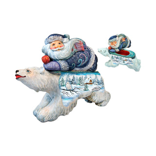 a christmas ornament of a polar bear and santa on a sleigh