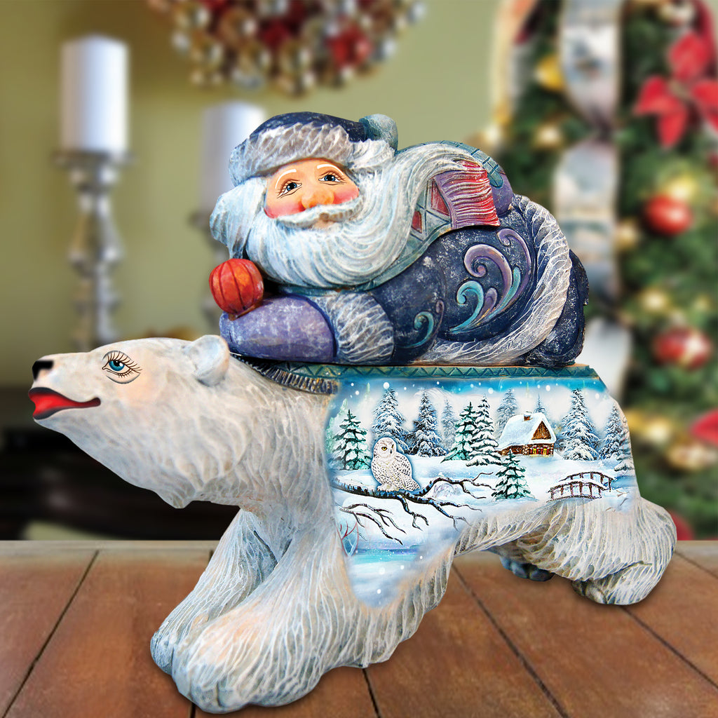 a statue of a polar bear with a santa clause on it's back