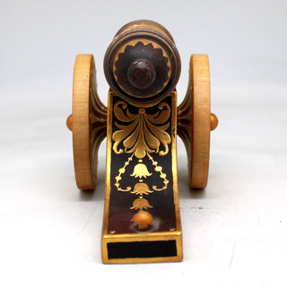 a small wooden toy car with a wooden wheel