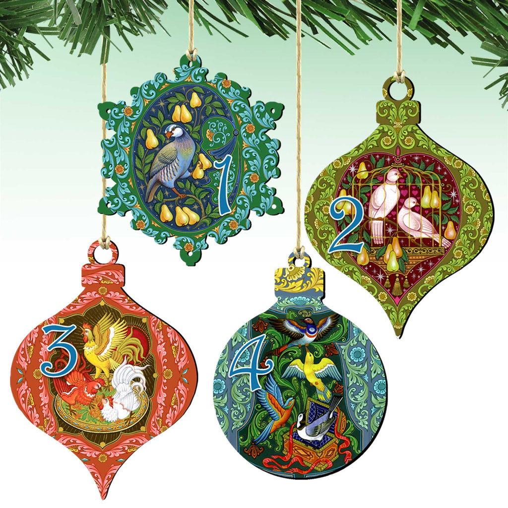 four ornate Christmas ornaments hanging from strings, each with a unique design and color scheme.