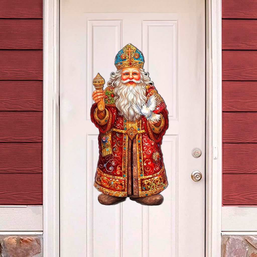 a statue of a santa claus is on the front door of a house