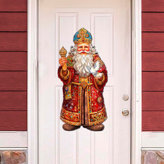 a statue of a santa claus is on the front door of a house