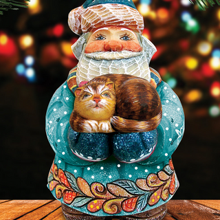 A colorful ceramic Santa Claus figurine holding a sleeping cat.