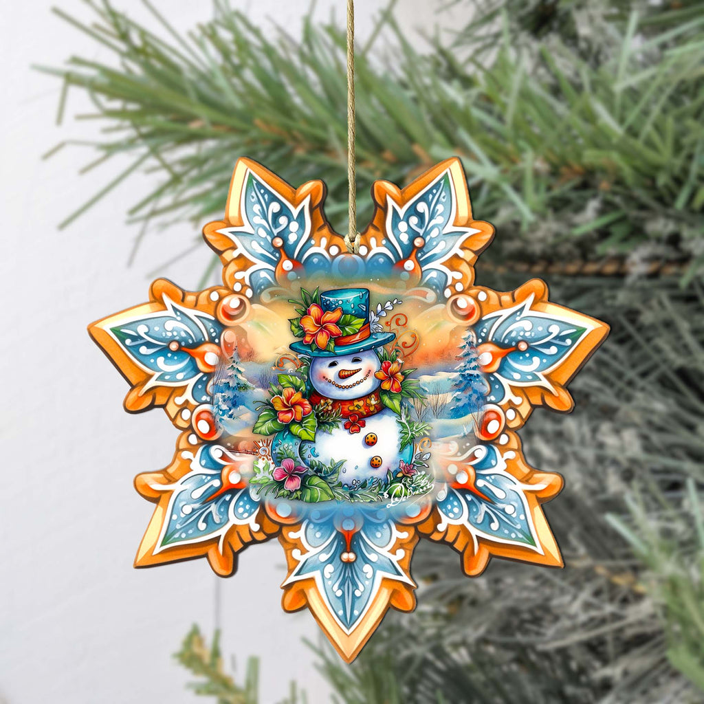 a snowman ornament hanging from a tree