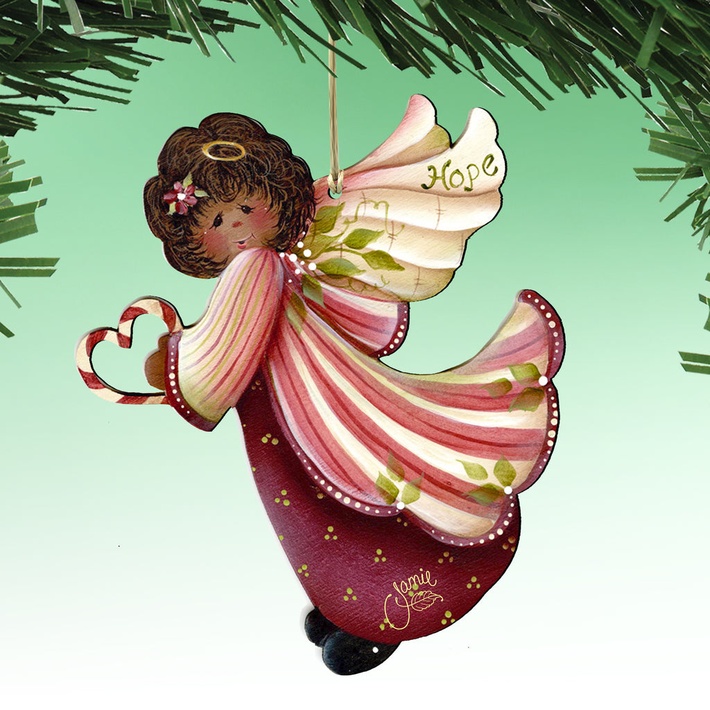 A colorful ornament of an angel with a heart-shaped symbol on its left hand, hanging from a branch.