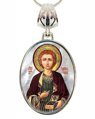 a pendant with a religious icon of a person, possibly a saint or religious figure, wearing a robe and holding a book.