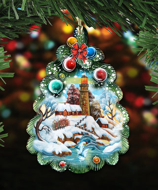A decorative ornament featuring a winter landscape with a lighthouse, snow-covered houses, and a frozen lake, surrounded by colorful Christmas lights.