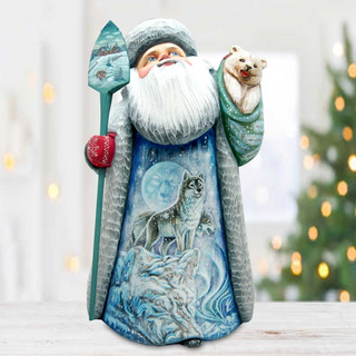 Santa Claus figurine with a wolf on its back, holding a sled and a snowflake, standing in front of a blurred Christmas tree.