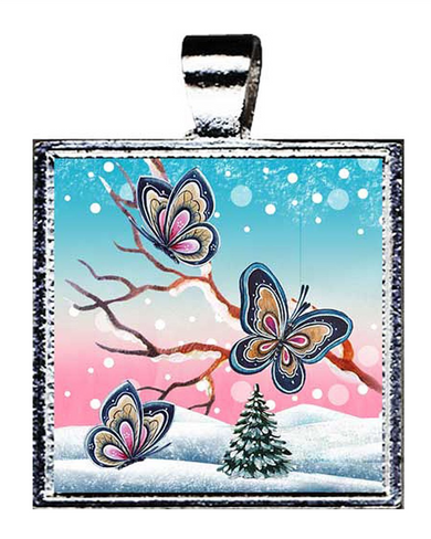 A square pendant with a design featuring three colorful butterflies against a snowy landscape with a small tree in the background.