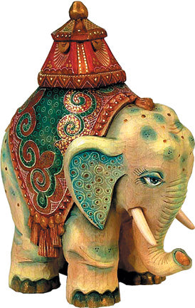 A wooden elephant statue with a colorful, intricately designed blanket on its back, and a decorative hat on its head.
