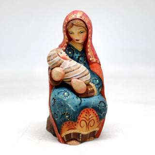 a figurine of a woman holding a baby