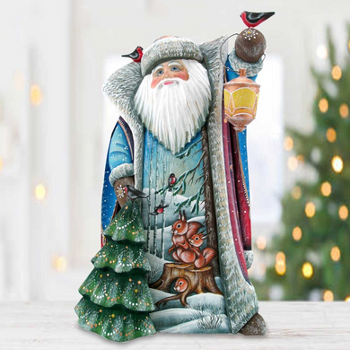 A colorful and detailed figurine of Santa Claus, adorned with various holiday-themed elements such as birds, snow, and a Christmas tree.