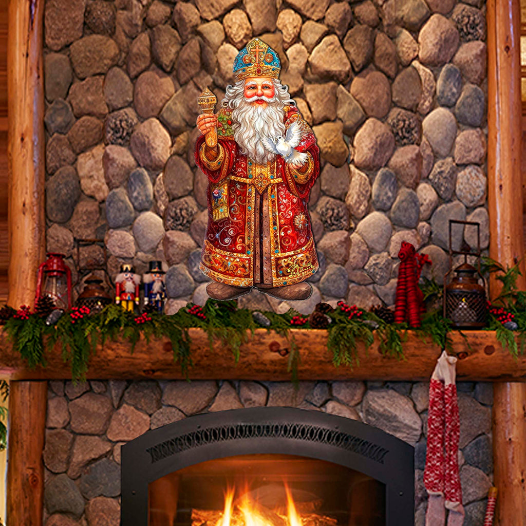 a fireplace with a statue of santa claus on top of it
