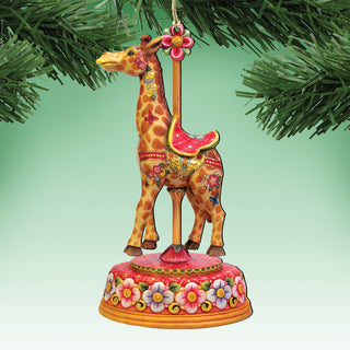 A decorative ornament featuring a giraffe on a carousel base, surrounded by greenery.