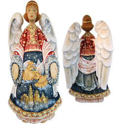 two angel statues, one with a red and gold outfit and the other with a blue and white outfit. Both statues have large white wings and are holding a small golden figure.