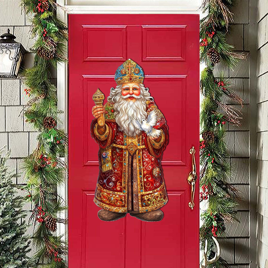 a red door with a statue of santa on it