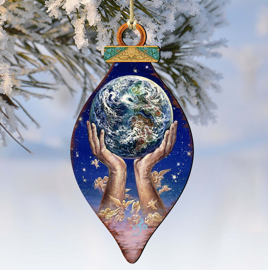 A hand holding a globe of the Earth, with angels surrounding it, against a snowy background.