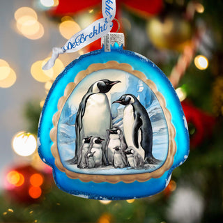 a christmas ornament with penguins on it