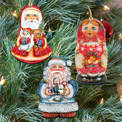 three ornaments hanging on a Christmas tree, including a Santa Claus figure, a Russian nesting doll, and a snowman.