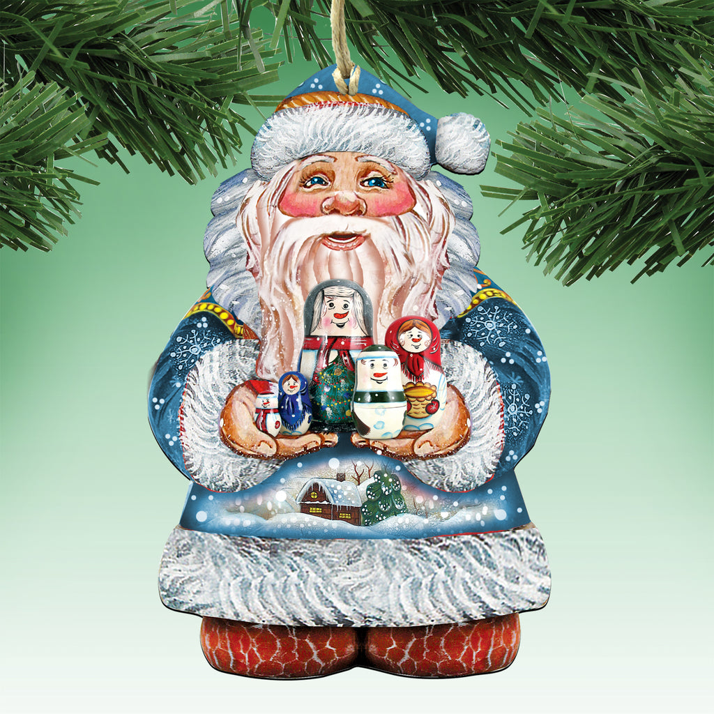 A colorful ornament of Santa Claus holding a Christmas tree and various ornaments, including a snowman and a reindeer, against a green background.