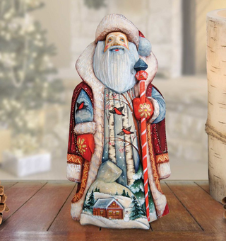 A hand-painted Santa Claus figurine with a long red pole and a red and white striped hat, standing on a wooden surface.