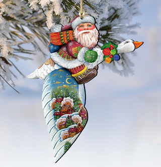 A colorful ornament depicting Santa Claus riding a goose, with a snowy landscape and houses in the background.