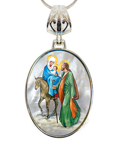 A pendant necklace with a circular design featuring a religious scene with a woman, a baby, and a man on a horse.