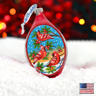 a christmas ornament with a red bird on it