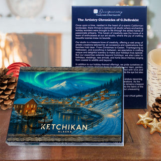 a large, colorful postcard with a winter scene of a village and mountains, along with a smaller, blue card with text and a mountain landscape.