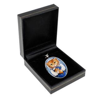 A black jewelry box containing a pendant with a cat design, placed on a white background.