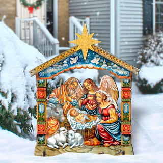 A colorful and detailed outdoor nativity scene depicting the birth of Jesus Christ, with figures of the Virgin Mary, Joseph, and baby Jesus surrounded by animals.