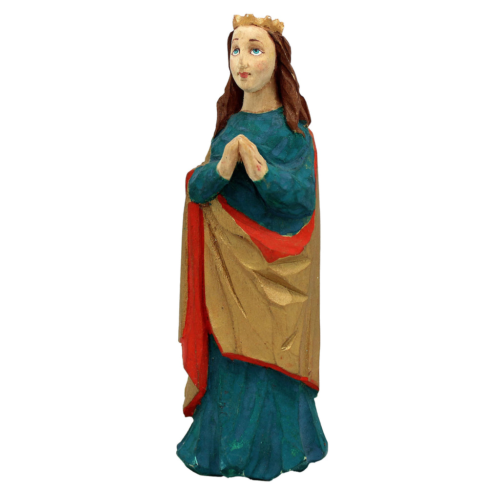 A statue of a woman with long brown hair, wearing a blue dress and a red and gold robe, standing with her hands clasped in front of her.