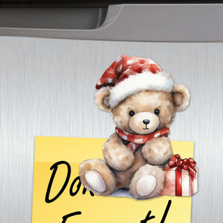 a picture of a teddy bear with a santa hat on
