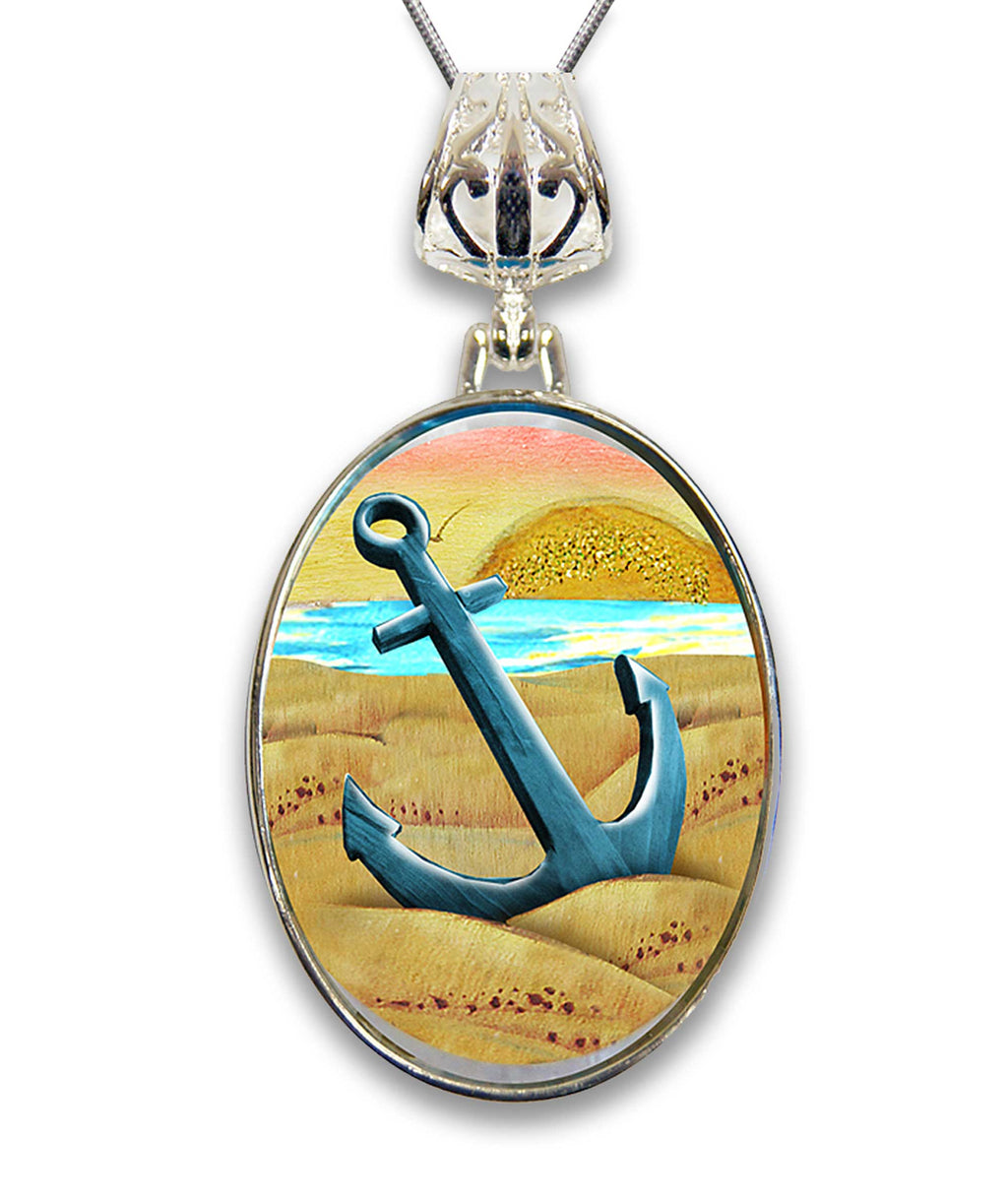A pendant necklace with a circular design featuring a blue anchor and a sunset landscape.