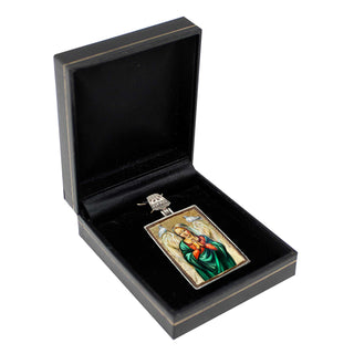 a black jewelry box containing a framed religious icon, possibly a religious symbol or portrait.