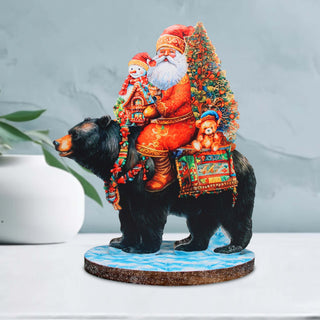 a statue of a bear with a santa clause on it's back