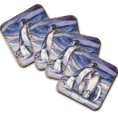 A set of four square coasters featuring images of penguins in various poses and settings.