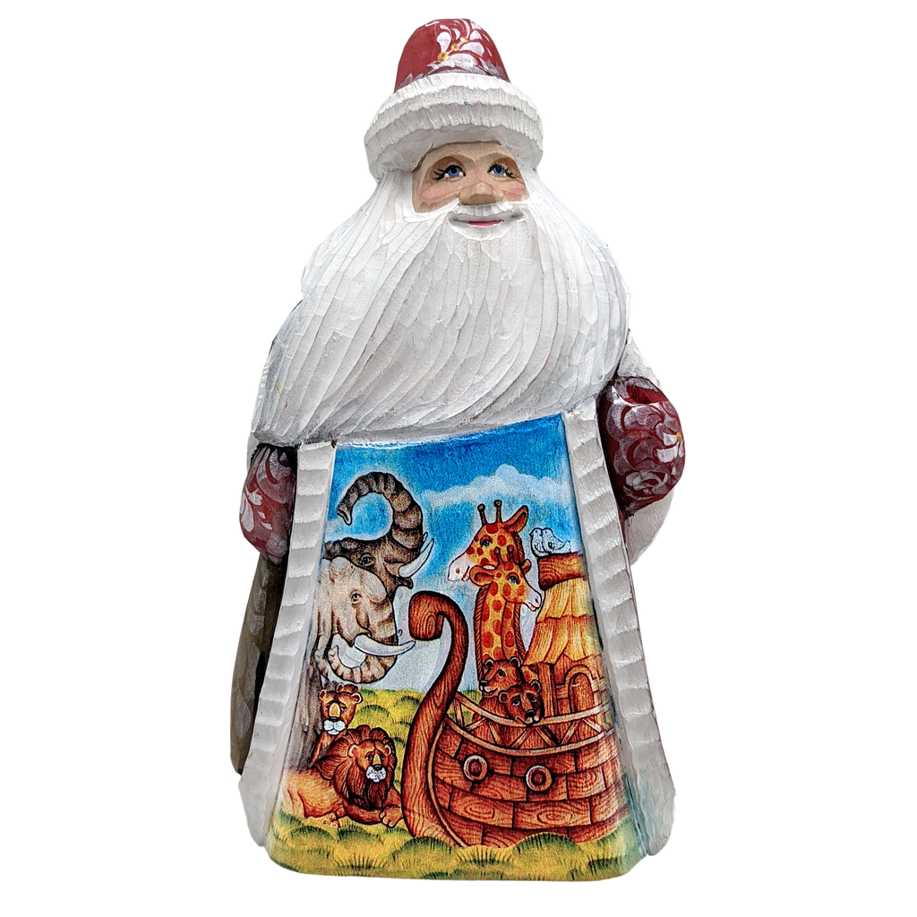 A carved wooden Santa Claus figure with a colorful sailboat design on the lower half of its body.