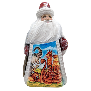 A carved wooden Santa Claus figure with a colorful sailboat design on the lower half of its body.
