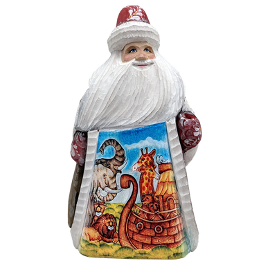 A carved wooden Santa Claus figure with a colorful sailboat design on the lower half of its body.