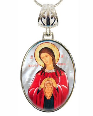 a necklace pendant with a religious icon of a woman in a red robe, holding a baby.