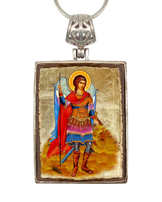 a pendant with a religious icon of a saint or angel, wearing a red cape and holding a staff or staff.