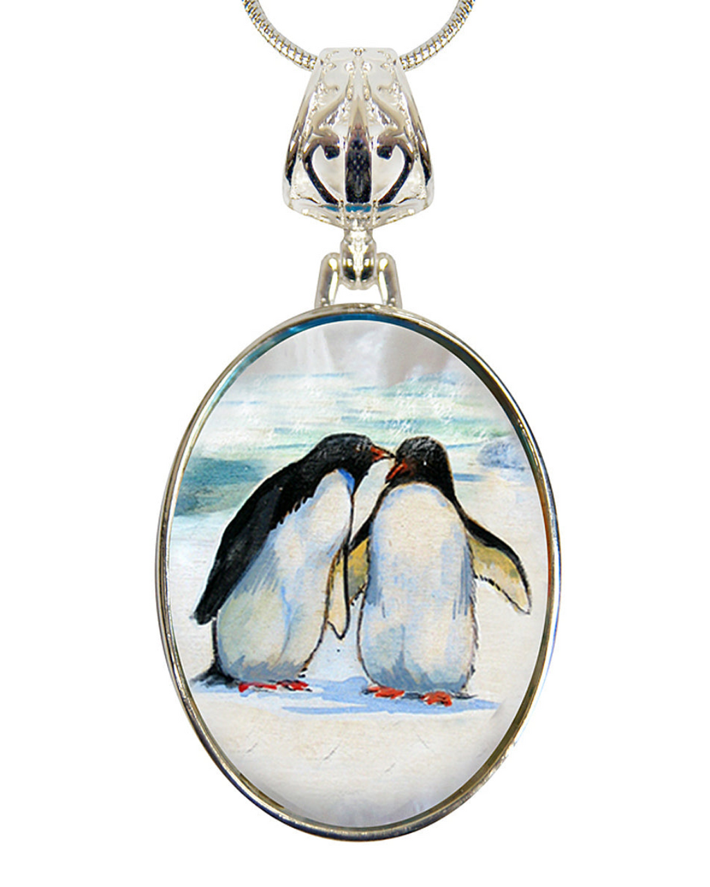 A pendant necklace with a circular design featuring two penguins standing close together on a snowy surface.