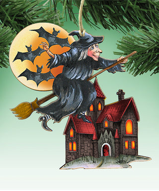 A witch on a broomstick flying over a house with bats on a full moon.
