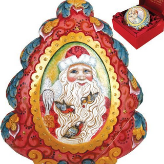 a decorative piece with a Santa Claus face and birds, set against a red background with gold accents.