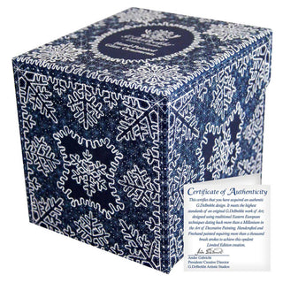 a box with a snowflake pattern and a certificate of authenticity.