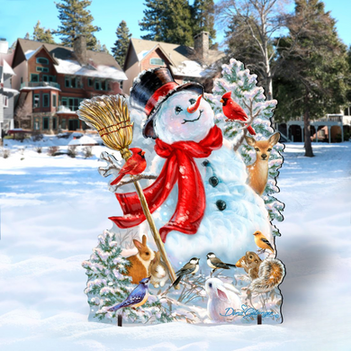 A snowman decorated with various animals, including a red scarf, a broom, and a bird, stands in a snowy landscape with houses and trees in the background.