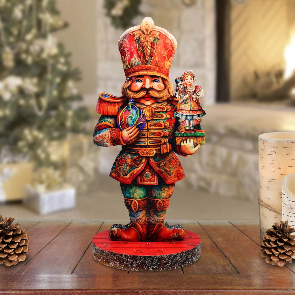 a figurine of a nutcracker holding a nutcracker