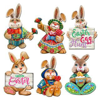 a set of four easter bunnies holding a sign