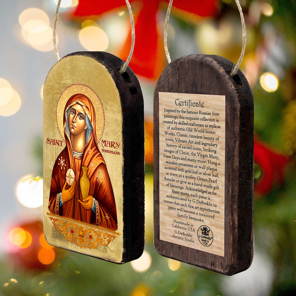 two wooden ornaments, each with a religious icon and a certificate of authenticity.